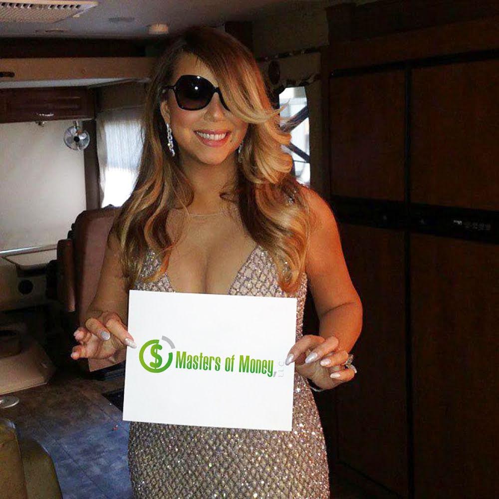 Mariah Carey Holding a Masters of Money Logo Sign Photo