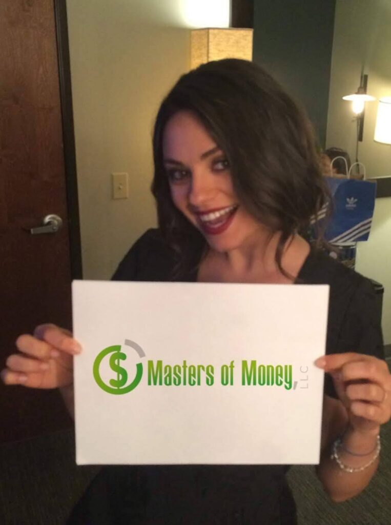 Mila Kunis Holding a Masters of Money Logo Sign Photo