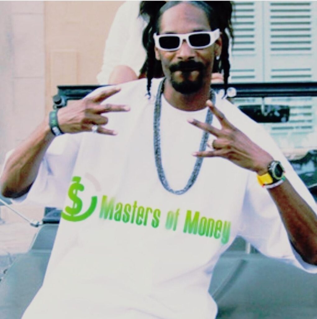 Snoop Dogg Wearing a Masters of Money Logo T-Shirt Photo